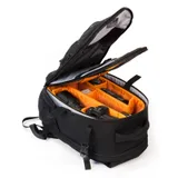 backpack lid lifted to show camera gear
