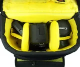Multiple interior and exterior pockets for batteries, media cards and accessories.     Fits camera with lens plus an accessory flash and two additional lenses.