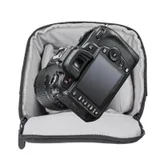 camera and lens inside of holster bag