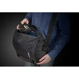 Thule Covert DSLR Messenger bag being worn