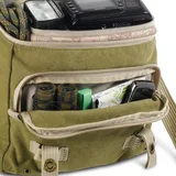 A large front pocket stores media accessories and personal items.