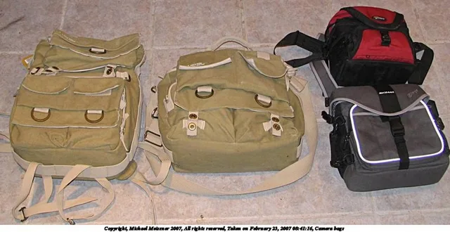 Here is a shot with 4 bags (National Geographic NG-5162 backpack, National Geographic NG-2475 shoulder bag, Slinger, and a Lowepro Nova 1) to show how big the bags are: