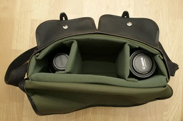 Main compartment dividers are in place. On the left is the 24-105 with the hood fitted. On the right is the 17-40 (underneath a lift-flap divider) with the 50mm on top.