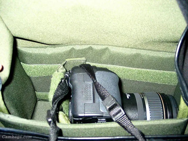 Bag interior shown with camera and lens positioned sideways. Room on the left for a second lens or p/s camera. My Canon G3 fits here nicely or a smaller lens. . Between the padded liner and the bag's shell are two full length open spaces or pockets (front
