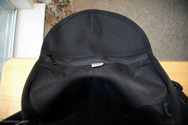 A zippered pocket on the inside of the flap.