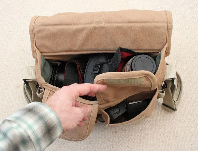 Into the front pocket goes the battery and the 220EX. (Normally the flash is in it's pouch, removed here so you can see it better).