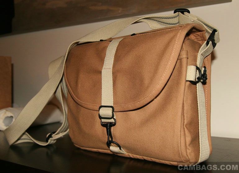 One of the things that makes this bag look less like a camera bag, IMO, is the thickness. At only 4.6" thick (exterior) it looks a lot more like a regular shoulder bag for carrying papers and stuff: