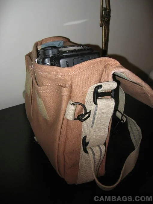 Side shot.. the camera sticks out a little bit from the top of the bag, but it's still held in there quite well (with most of the weight being in the lens the center of gravity is well below the edge of the bag)