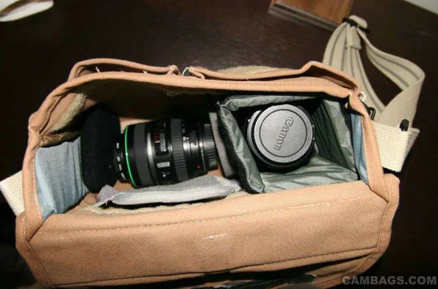 The 70-300 DO sits at the bottom of the main compartment, with a couple padded spacers on the sides (gleaned from other camera bags/lens cases):