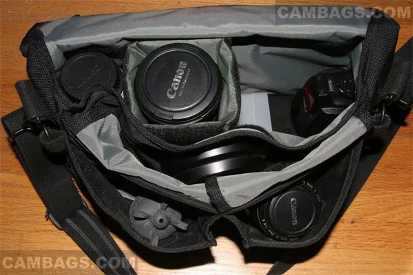 Here is another picture with front compartments folded open.  I do have a padded piece that sits along the top of my flash to protect it and the camera from scratching each other.