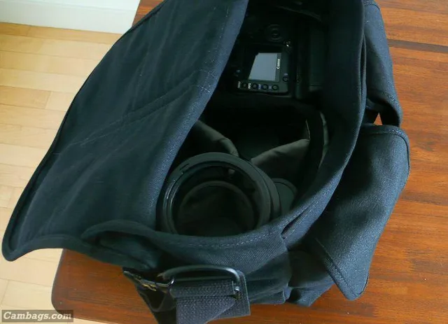 he lens hoods ride on top; this isn't as convenient as a Domke with side pockets where the lens hoods fit well.. but it works and isn't really a hassle. There aren't many traveler bags that could hold these lenses with the hoods on.