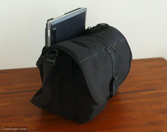 And now for the unfortunate part. I expected my laptop to be able to fit in the back pocket, but no such luck. The only time I'll have it with me is while actually traveling; I wouldn't walk around like this. You can also see that when fully packed, this