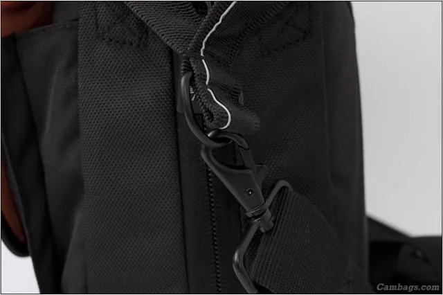 The shoulder strap has metal clips and the ring that it clips onto has been double stitched onto the bag strap giving it extra strength. Not shown but the shoulder strap also has a cushioned sleeve for extra comfort on the shoulder area.