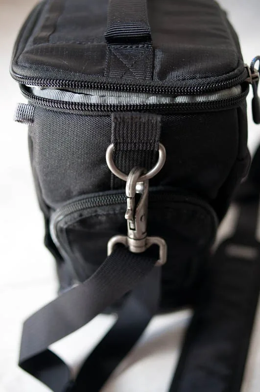As with all Think Tank bags, good strong metal clips for the shoulder strap. The shoulder strap is adequate with a non-slip finish but with minimal padding, extra padding isnt that important for a small bag like this.