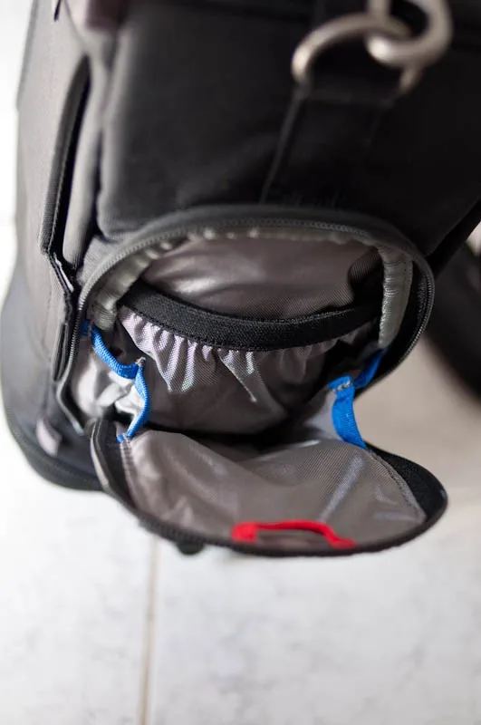 on the side there is a small pocket for the all weather cover(not shown) and accessories like spare batteries.