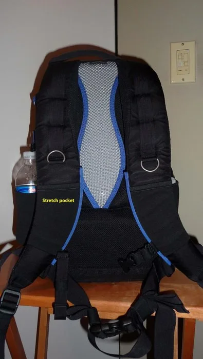 The silver portion you see is indented in which allows air to flow nicely and keeps the bag off of your spine. There are two stretch pockets, 2 metal D rings, and some loops for accessories. There is also a waist belt (removable) and chest strap (works ve