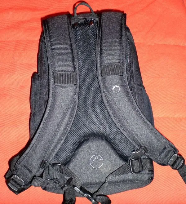 Padded back. Very comfortable. Even with gripped EOS 40D can't feel a thing on my back.