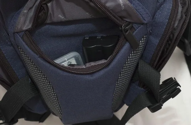 The bag has 3 pockets at the front and sides.  In the front pocket I have a battery and compact flash cards with room for a few more accessories.