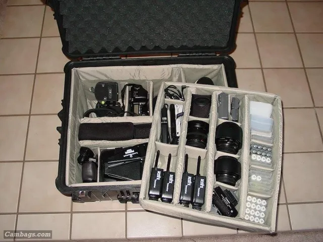 Now, ordering and opening were the easy parts... I spent the next several hours moving, measuring, placing, thinking and replacing all my gear. The next three shots show all the gear I was hoping this case would hold all nicely packed inside and organized. The first one shows the top layer and deeper side sections filled. One thing I wanted to note here is that there is Velcro on either side of the top tray to hold it in once its set down. Hope that makes sense. You can see from the Red labels what each item is.