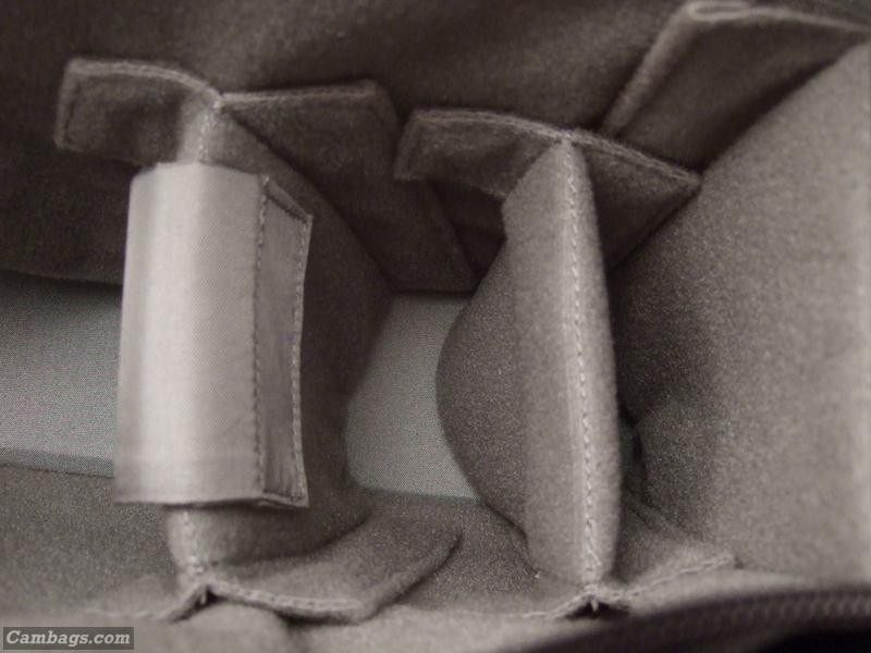 The whole point of getting a new bag was to be able to carry my EOS 40D at the ready. I reconfigured the inner workings of the supplied dividers to create a sturdier foundation for lens-down carry.