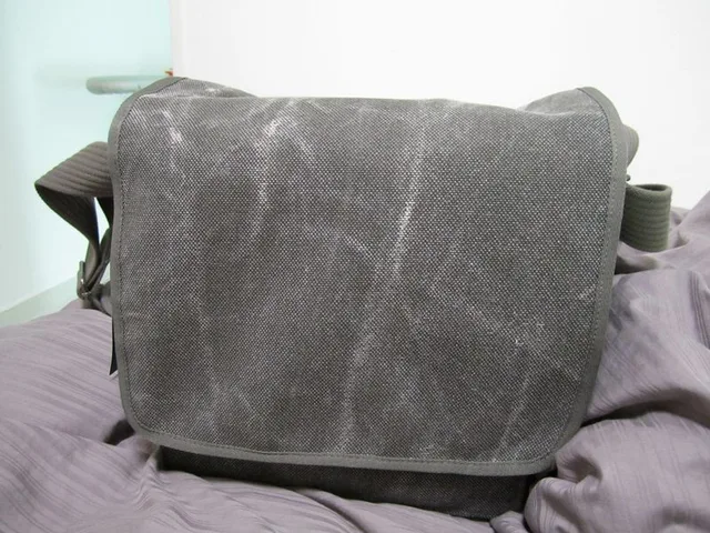 It's got great materials and comes with a weathered look. At first glance, my mom said it looked like an old army bag, so this bag definitely passes as being non-camera like. The stitching is perfect as well.