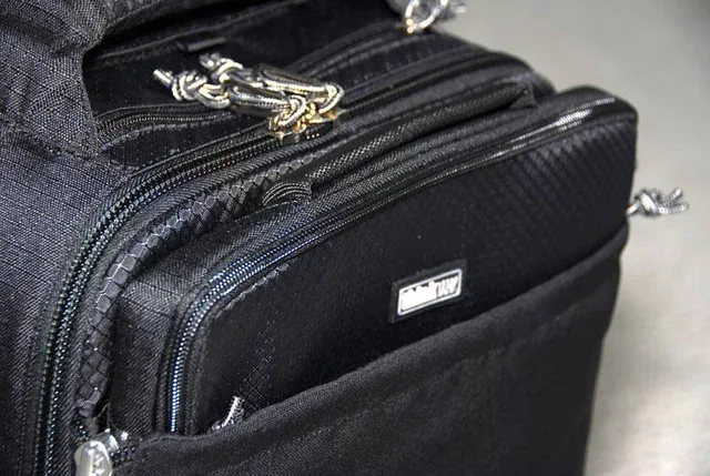 The laptop bag slides into a compartment on the front of the bag