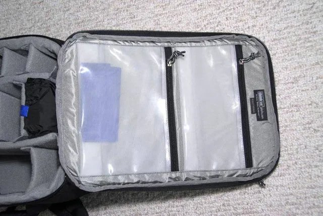 The inside lid has two large clear compartments